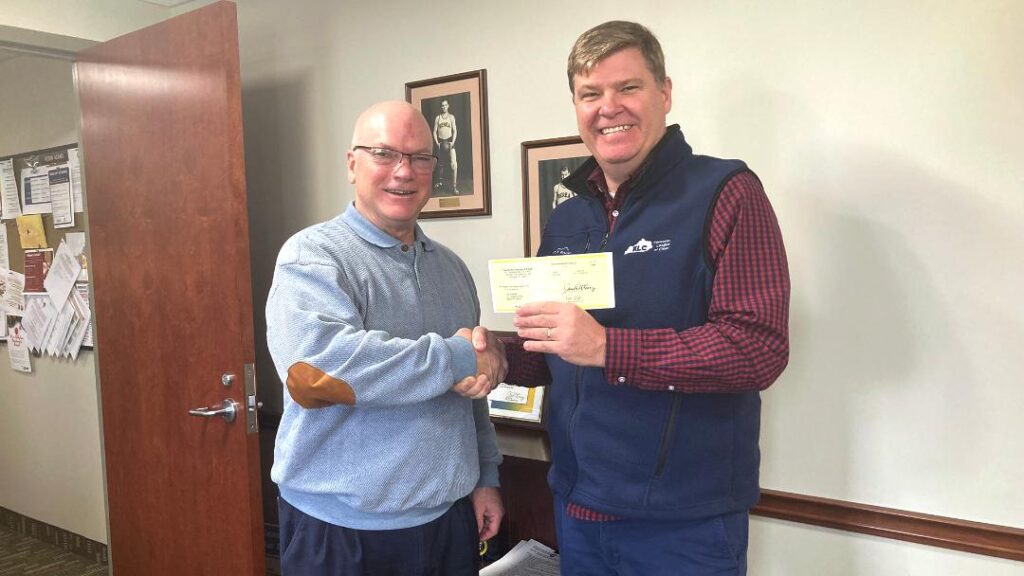 KLC Loss Control Consultant Chris Hayes presents Berea Mayor and KLC Board of Directors member Bruce Fraley with a KLC Liability Grant.
