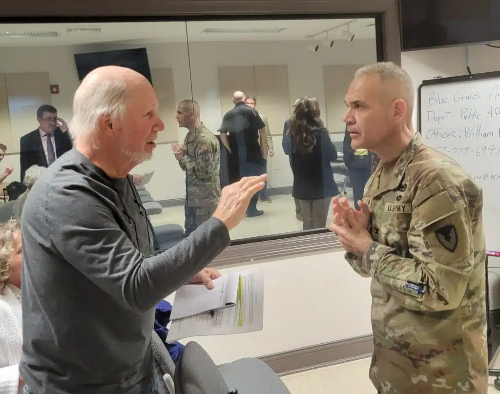 Craig Williams shares a word with Blue Grass Army Depot Commander Col. Brett Ayvazian following a Wednesday meeting about the open burning/open detonation of obsolete munitions at the depot. Officials said the U.S. Department of Defense has cleared the way for alternatives to OB/OD.